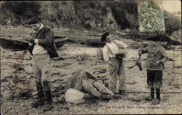Postcard France, children and man in traditional costumes on the beach, lobster