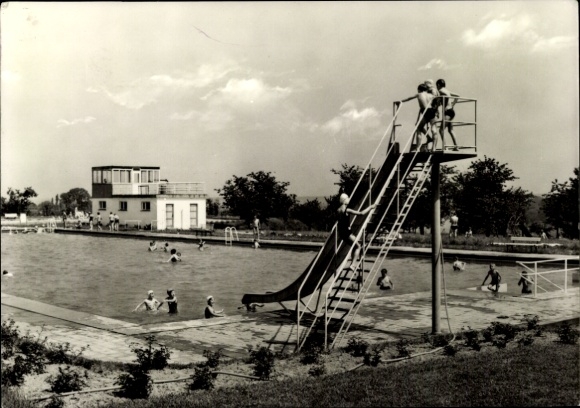 Postcard Strehla on the Elbe Saxony, swimming pool with slide, children in the water, clouds in the sky
