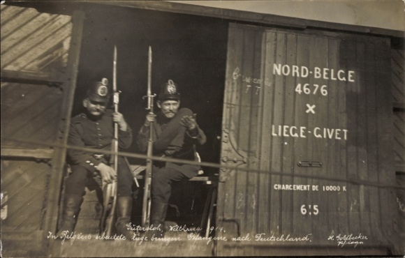 Photo Postcard Gütersloh, trains captured in Belgium bring prisoners of war to Germany, 1st World War