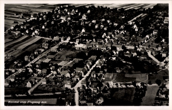 Postcard Korntal Münchingen in Strohgäu, aerial view of houses, streets, fields