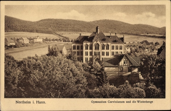 Postcard Northeim in Lower Saxony, Corvinianum high school and the winter mountains