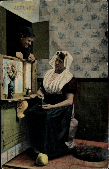 Postcard woman in Dutch costume, man crocheting, Zeeland