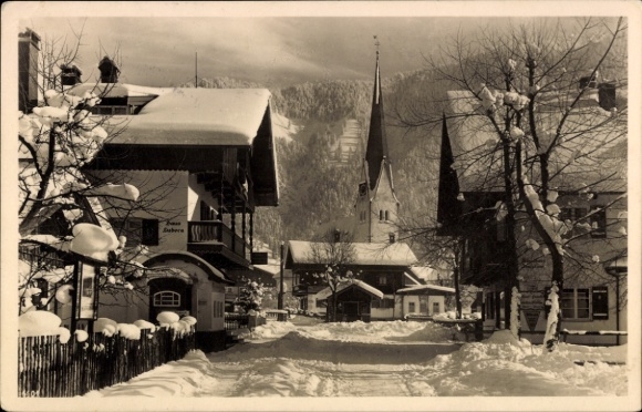 Postcard Bayrischzell in the Mangfall Mountains Upper Bavaria, snow-covered street, church, building, winter landscape