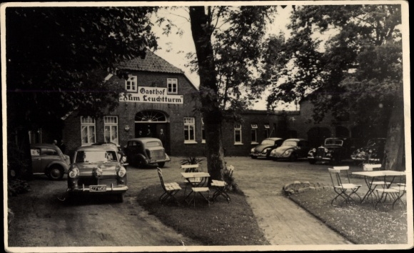 Photo Postcard Apen in Oldenburg Ammerland, Gasthof Zum Leuchtturm with cars