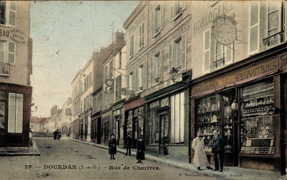 Postcard Dourdan CPA 78, street scene with people, shops and a tram.
