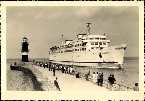 Postcard railway ferry MS Warnemünde at the entrance to the port, signal tower, pier