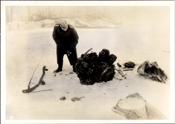 Photo of a Wehrmacht soldier with the remains of a French aircraft, February 1940, WWII