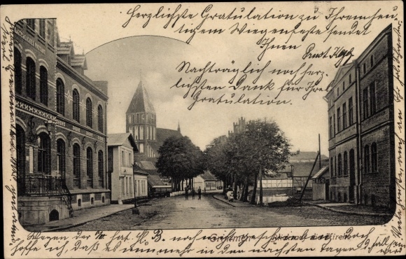 Ak Grimmen in Mecklenburg Vorpommern, straatgedeelte, kerk