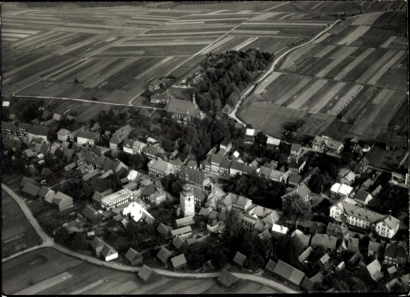 Postcard Großbreitenbach in Thuringia, view of a church, many houses and fields can be seen.