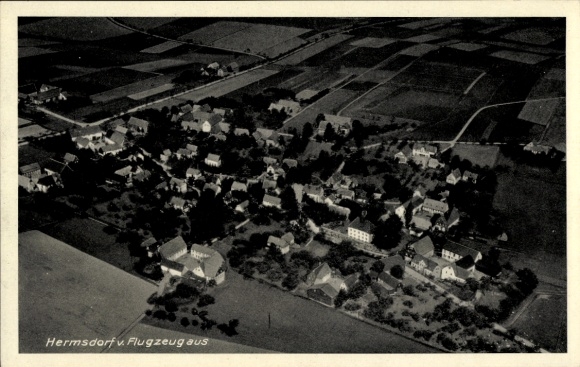 Postcard Hermsdorf am Wilisch Glashütte in Saxony, aerial view of many houses, rural surroundings