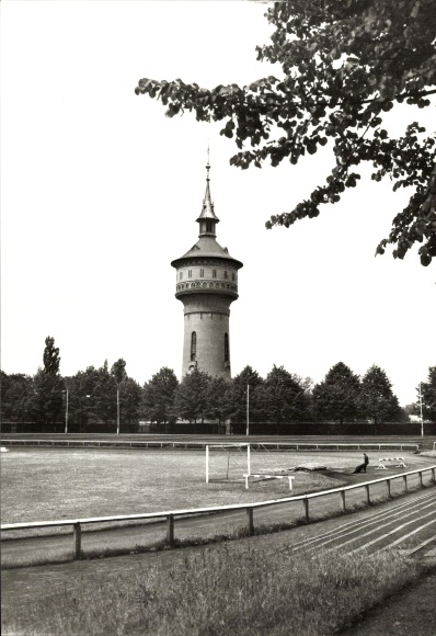 Postcard Forst in the Lusatia, water tower, stadium, trees, football field, black and white photo