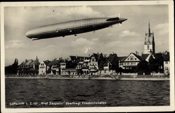 Postcard Friedrichshafen on Lake Constance, airship LZ 127 Graf Zeppelin flies over the city