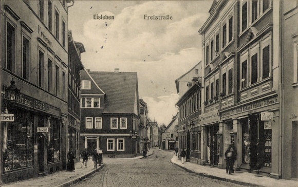 Postcard Lutherstadt Eisleben, Freistraße, shops, hairdresser