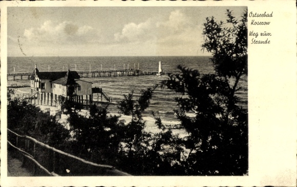 Ak Ostseebad Koserow auf Usedom, Ostseebad  Weg zum Strande, Küstenansicht, Pier