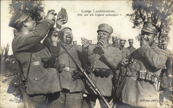 Dresden Wachwitz PC, four cheerful soldiers with rifles and cartridge belts. One holds a...