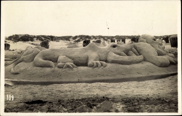 Photo Postcard party on the beach, figure, creature with a human head
