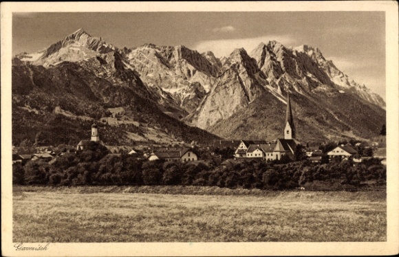 Postcard Partenkirchen in Upper Bavaria, mountain landscape, village with church, high mountains in the background