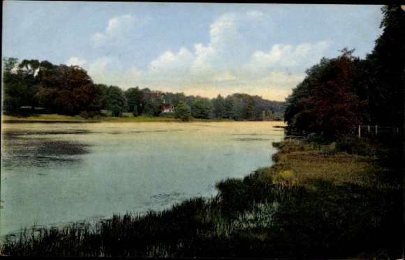 Postcard Reinbek in Schleswig-Holstein, landscape with a lake, trees, clouds, buildings in the background