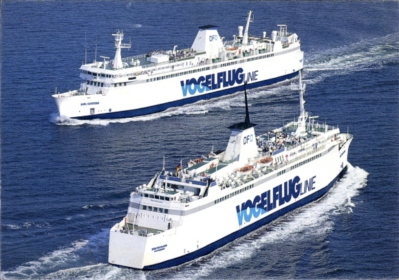Postcard Puttgarden Island Fehmarn, two ferries sail side by side on the sea.