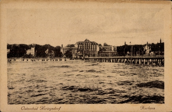 Postcard Ostseebad Heringsdorf on Usedom, Kurhaus, Baltic Sea resort building on the water, waves, jetty