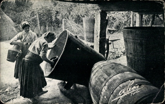 PC Portugal, two women in traditional costume, barrels