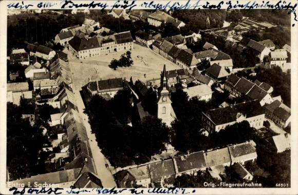 Postcard Elstra in Upper Lusatia Saxony, aerial view of Elstra, church in the foreground, apartments,