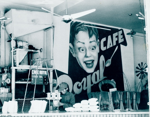 Photo coffee shop, sales counter, wall advertising Cafe Royal, coffee bags, brooms