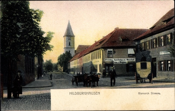 KP Hildburghausen w Turyngii, widok na ulicę Bismarck, wóz zaprzężony w woły, apteka J. Wagner