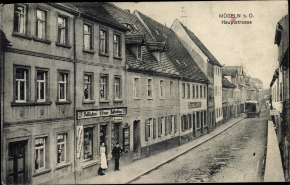 Postcard Mügeln in Saxony, main street, shop