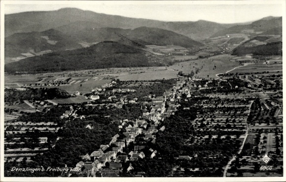 Postcard Denzlingen im Breisgau, aerial view of a residential area surrounded by mountains and fields, black