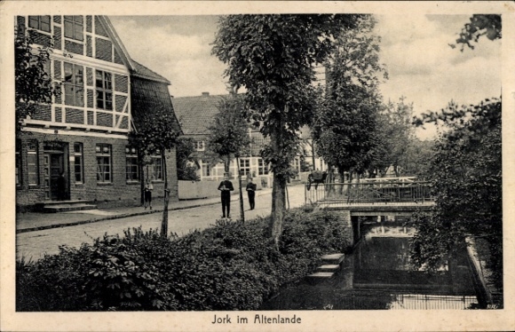 Postcard Jork, school children at a small bridge, residential building