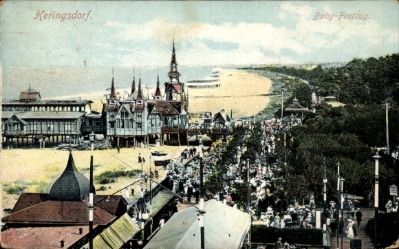 Postcard Ostseebad Heringsdorf on Usedom, front view of beach promenade, crowd, festive