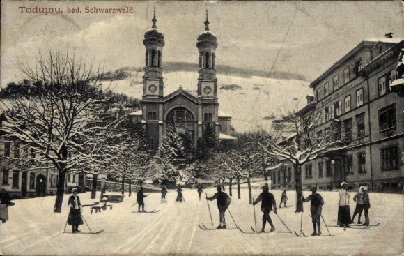Postcard Todtnau in the Black Forest, snowy landscape, church, houses, people on skis