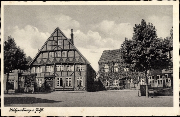 Ansichtkaart Lütjenburg in Holstein, gedeeltelijk aanzicht met vakwerkhuis en herberg