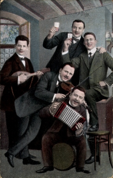 Postcard Hermsdorf in the Ore Mountains, five men in a room. One plays the violin, another chords...