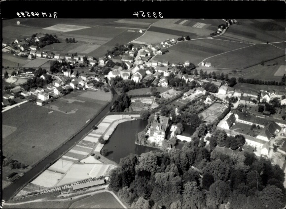 Postcard Taufkirchen near Munich, small town with a castle and park, surrounding fields and town...