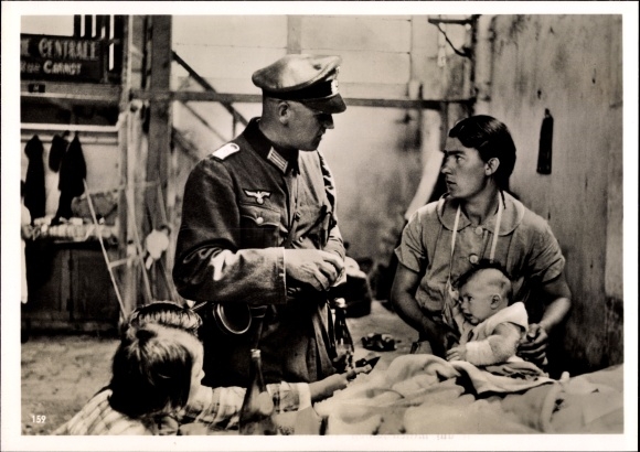 Photo of a German military doctor with a French civilian population, June 1940