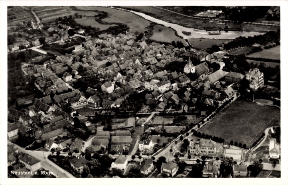 Postcard Neustadt am Rübenberge, aerial view of many roofs, church, river