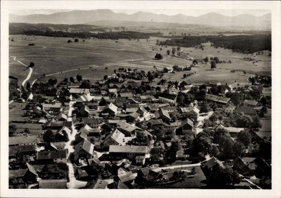 Postcard Huglfing in Upper Bavaria, aerial view of green landscape, many roofs, rural surroundings