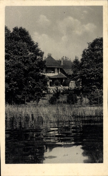 Postcard Bad Sassendorf in Westphalia, house on the water, surrounded by trees, clouds in the sky