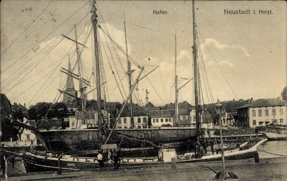 Neustadt in Holstein, sailing ships in the harbor, houses and buildings, clear weather, daylight,...