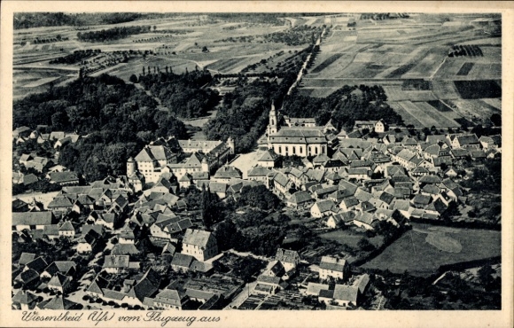 Postcard Wiesentheid in Lower Franconia, aerial view of village view, residential buildings, church