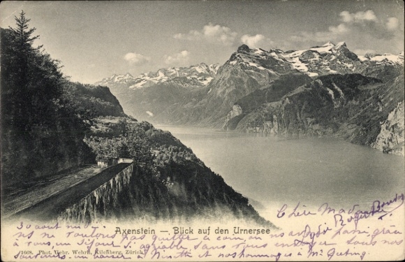 KP Axenstein Kanton Schwyz, widok na jezioro Uri, góry w tle, z tekstem