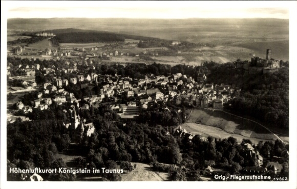 Ak Königstein im Taunus, Luftaufnahme von Königstein, Häuseransicht, Hügelkulisse, Burgruine