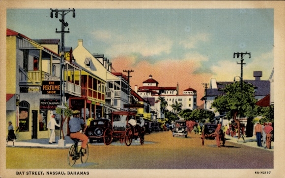 Ak Nassau Bahamas, BAY STREET,  Geschäfte, Fahrräder, alte Autos
