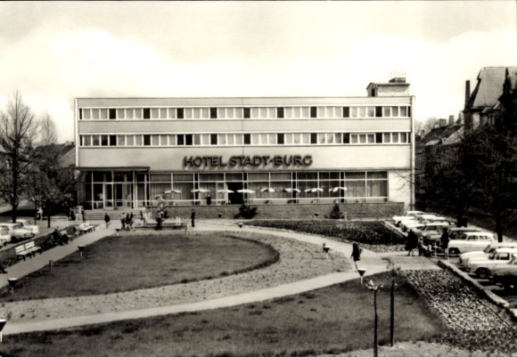Postcard Burg near Magdeburg, Hotel Stadt Burg, modern building, park with paths, cars in parking lot