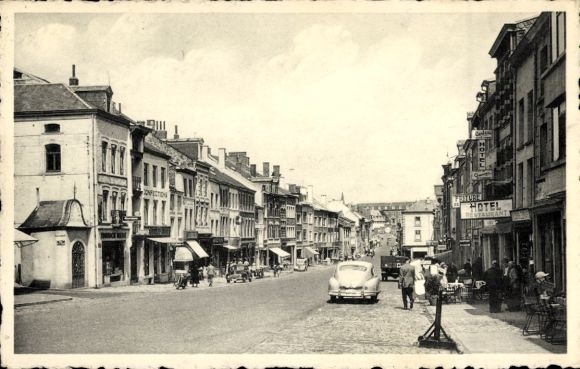 Postcard Bastogne Wallonia Luxembourg, street with houses, hotel, restaurants, cars, people