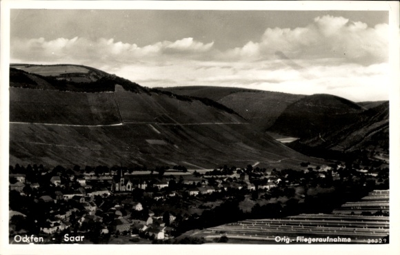 Postcard Ockfen on the Saar, aerial view of idyllic landscape, hills, village view