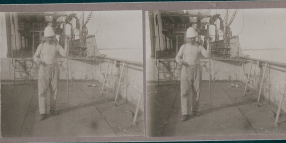 Stereo photo of a man on a ship off the Gambian coast, circa 1915
