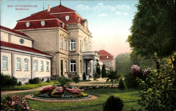Ak Bad Rothenfelde am Teutoburger Wald, Badehaus,  Architektur, farbenfrohe Blütenanlage